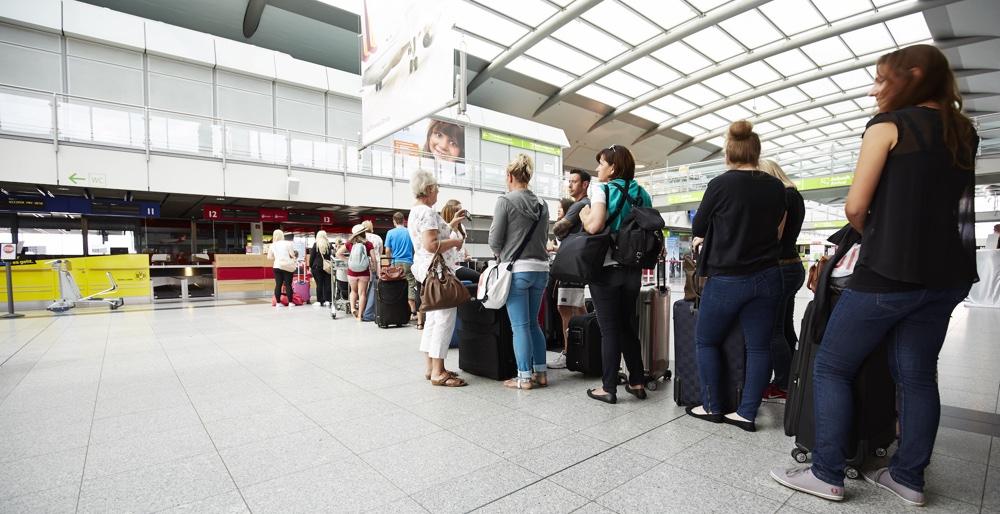 air travellers waiting to board