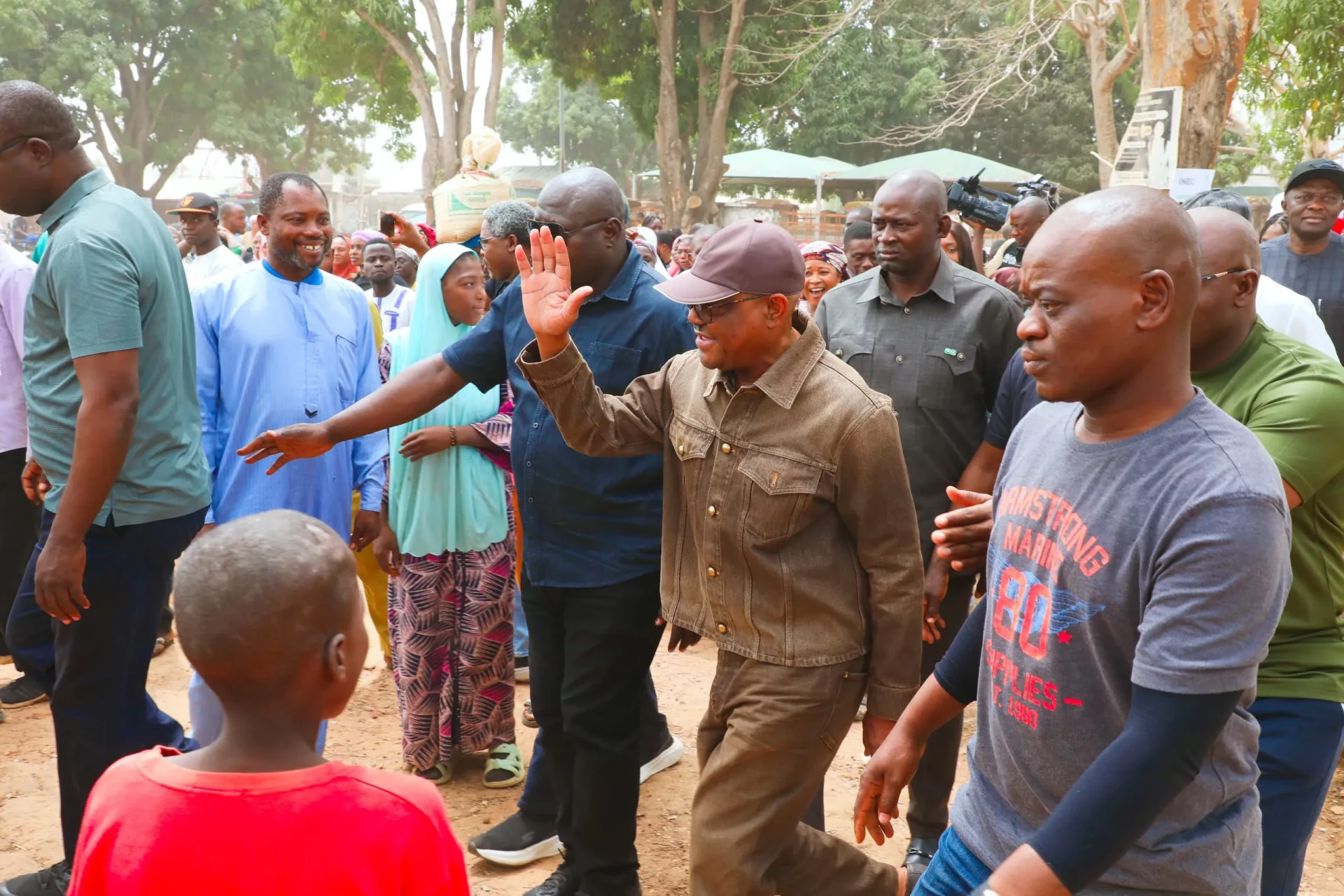 Nyesom Wike (waving a hand) in jean clothing during the FCT pollNyesom Wike (waving a hand) in jean clothing during the FCT poll
